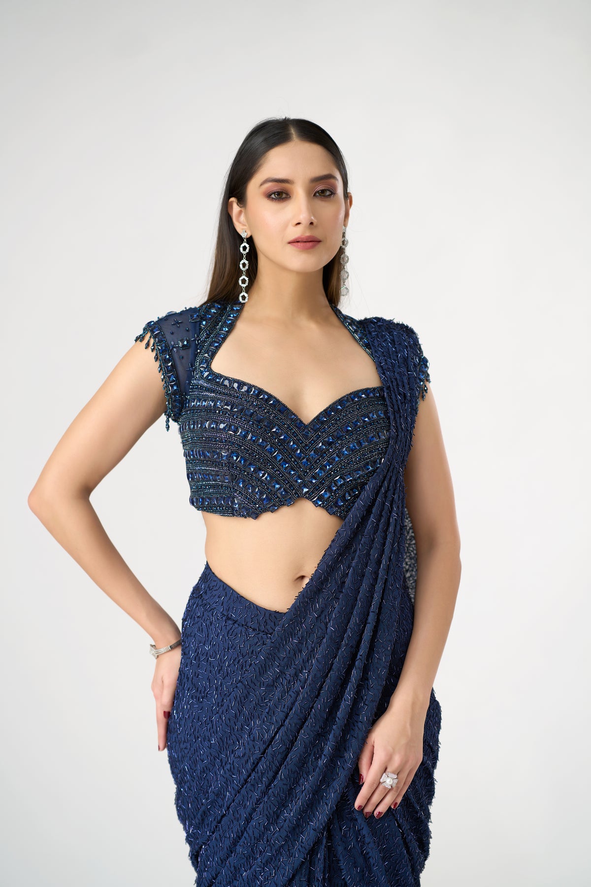 BLUE NET PRE DRAPED SAREE WITH CRYSTAL EMBELLISHED BLOUSE | Nishly Fashion House