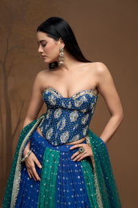 Stylish green embroidered corset lehenga choli set with sparkling mirror work, ideal for bridesmaids, wedding guests, and festive party wear.