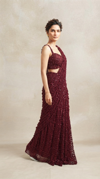Front view of red sequin embroidered pre-draped saree with blouse