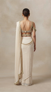 Off-white embroidered pre-draped saree with designer blouse for weddings and special occasions