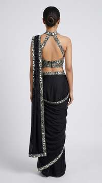 Stylish black halter neck pre-draped saree with intricate mirror work for cocktail nights, parties and special occasions