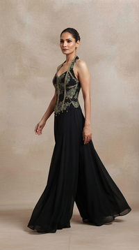 Black sharara pants with green embroidery and intricate sequin detailing