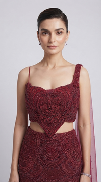 Maroon embroidered wedding lehenga set with embellished blouse and attached dupatta